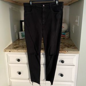 High waisted jeans with holes in both knees